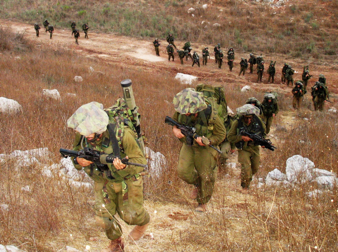 Israeli soldiers march in southern Lebanon